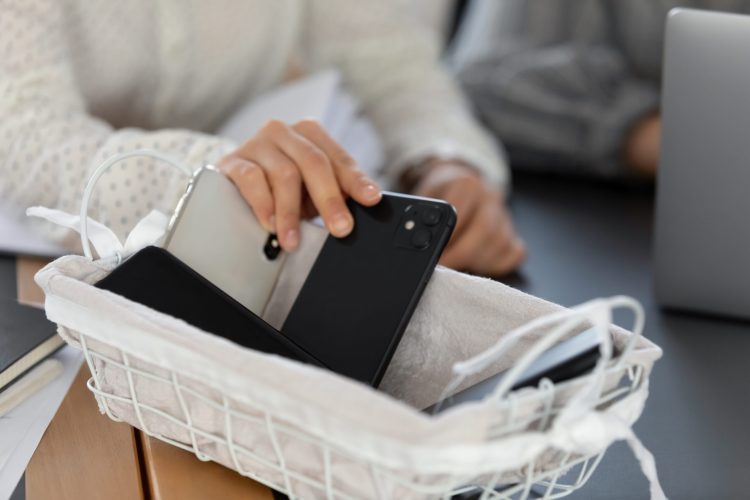 Putting phones into a basket