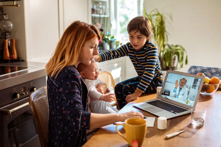 Woman with children accessing virtual health care