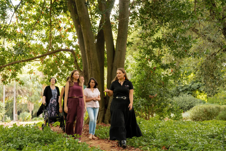 Iteka Sanderson-Bromley conducts an Aboriginal cultural tour through the Adelaide Botanic Garden.