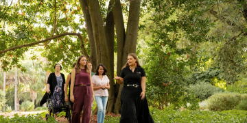 Iteka Sanderson-Bromley conducts an Aboriginal cultural tour through the Adelaide Botanic Garden.