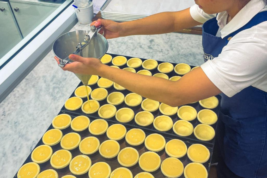 Portuguese custard tarts being made at Saudade in Adelaide Central Market