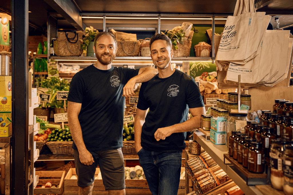 Rob Jr. and Chester standing inside House of Health at Adelaide Central Market