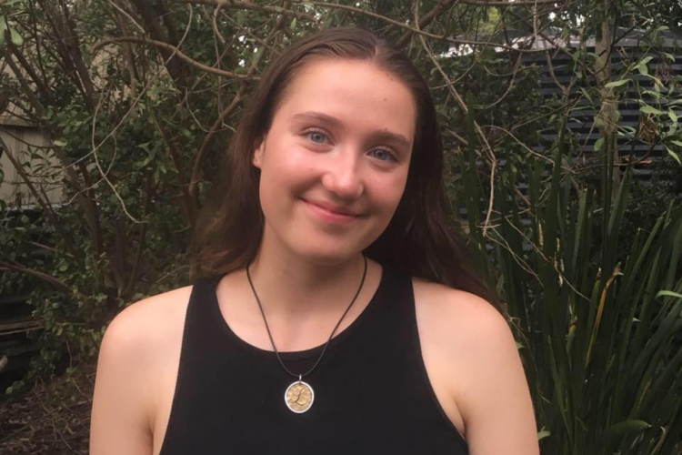 Lucy Stevens smiling outdoors