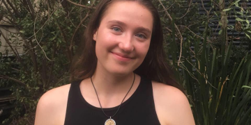 Lucy Stevens smiling outdoors