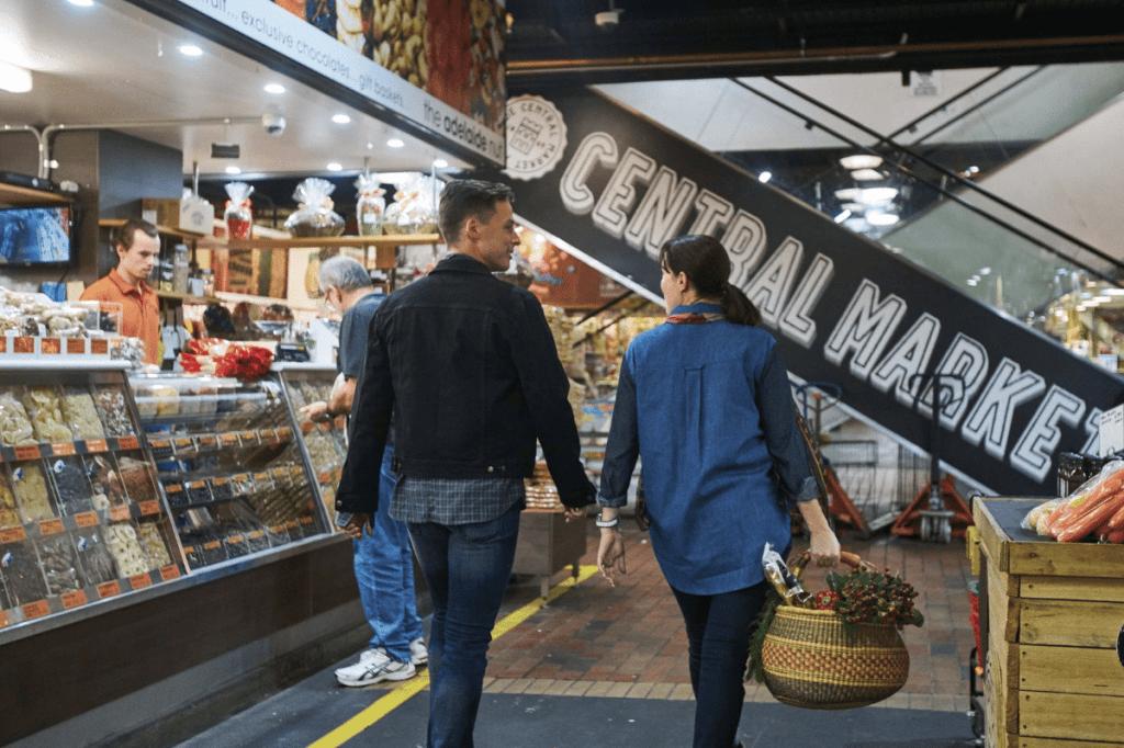 A couple shopping at the Adelaide Central Market.