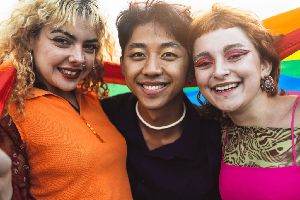 Young LGBTIQA+ people and allies smiling together.