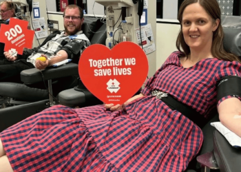 Alissa and Doug celebrating donation milestones at a Lifeblood donor centre
