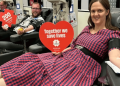 Alissa and Doug celebrating donation milestones at a Lifeblood donor centre