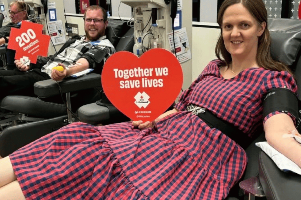Alissa and Doug celebrating donation milestones at a Lifeblood donor centre