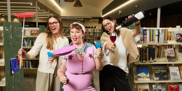 Erin Sundstrom, Lucy Frost and Kameron Bazzo learning to juggle while enjoying cocktails at a South Australian library