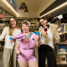 Erin Sundstrom, Lucy Frost and Kameron Bazzo learning to juggle while enjoying cocktails at a South Australian library